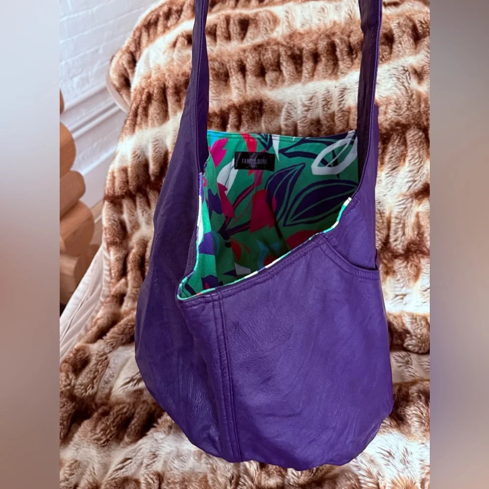 FANG & BONE faux leather cross body sling.